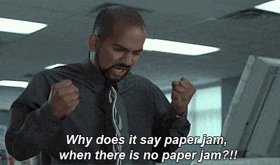 man in front of copier with text why does it say paper jam when there is no paper jam