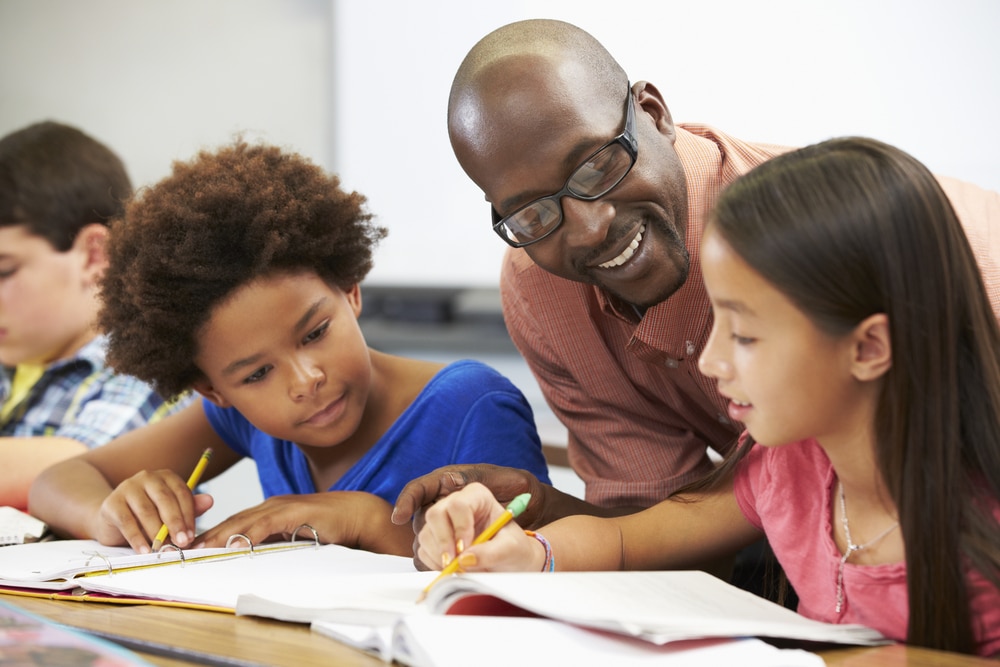 black male teacher with students