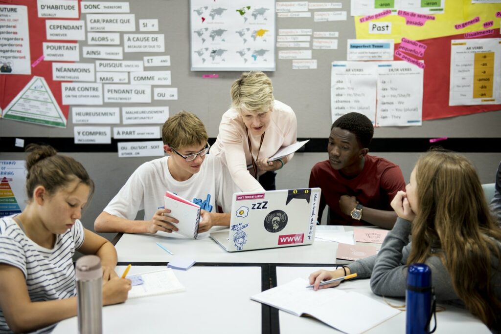 teacher talking with students