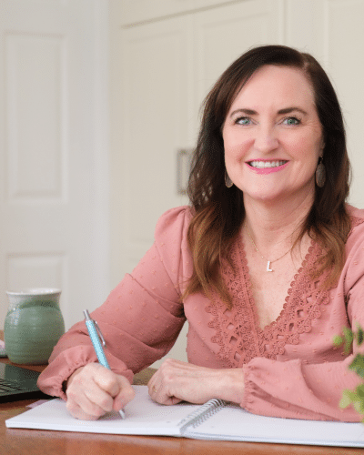 Lisa Van Gemert at desk